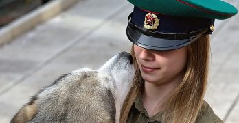 A Russian girl holding a dog