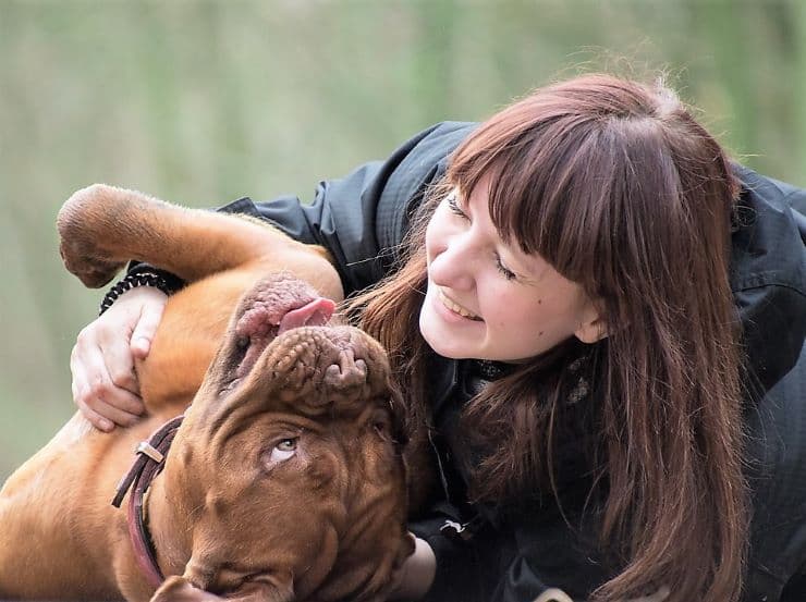 woman praising her dog